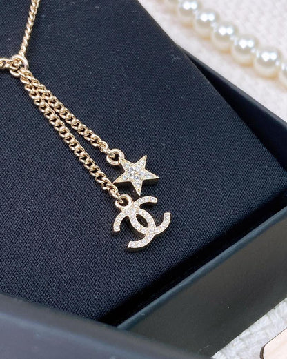 Chanel 23A Light Gold Dangling Star Logo Necklace