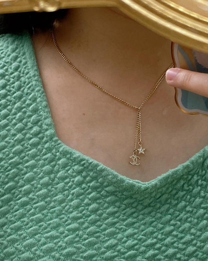 Chanel 23A Light Gold Dangling Star Logo Necklace